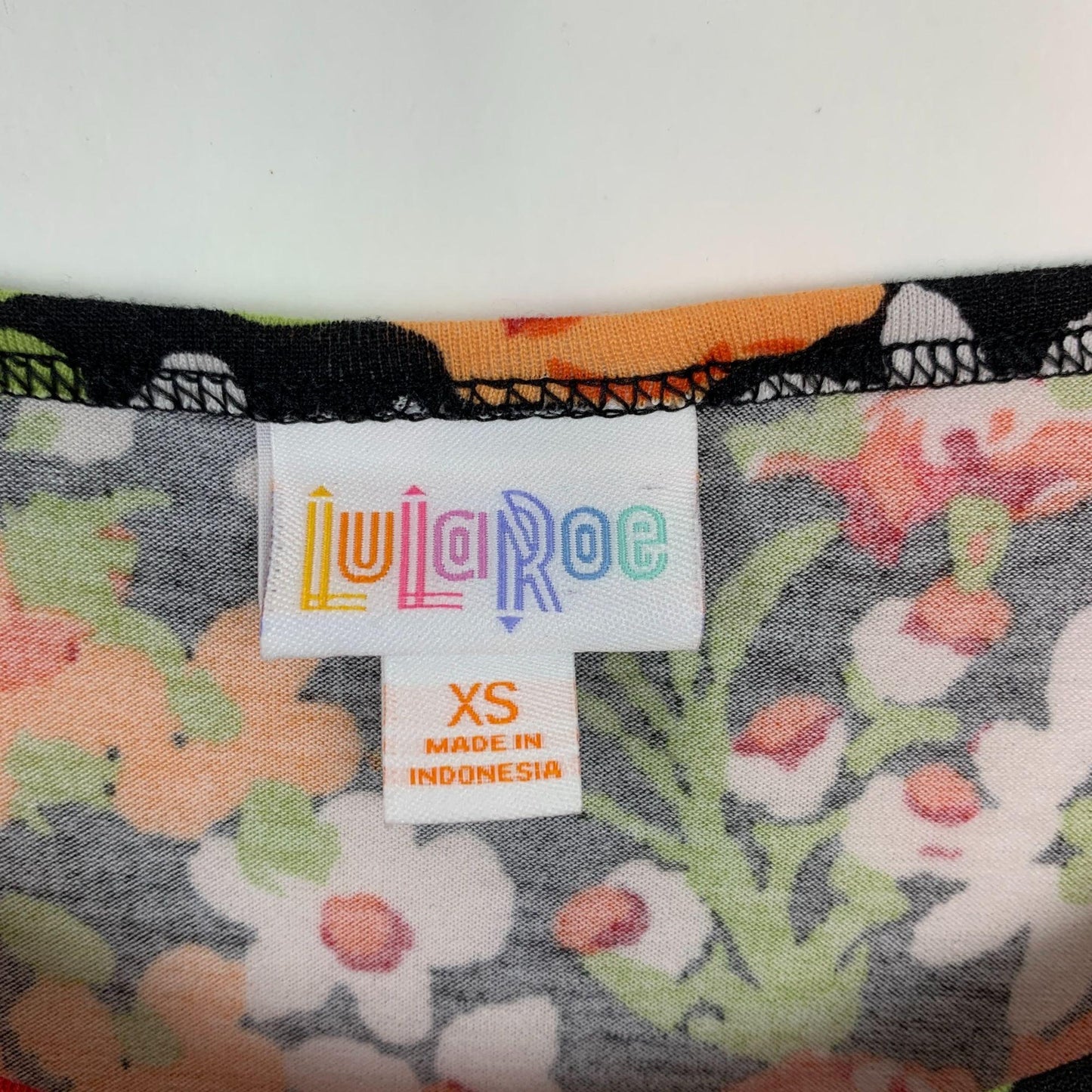 LuLaRoe XS Tunic Top Short Sleeve Shirt HiLo Hem Scoop Black Orange Floral Print